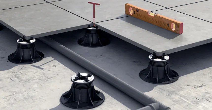 Pedestal flooring system with integrated piping